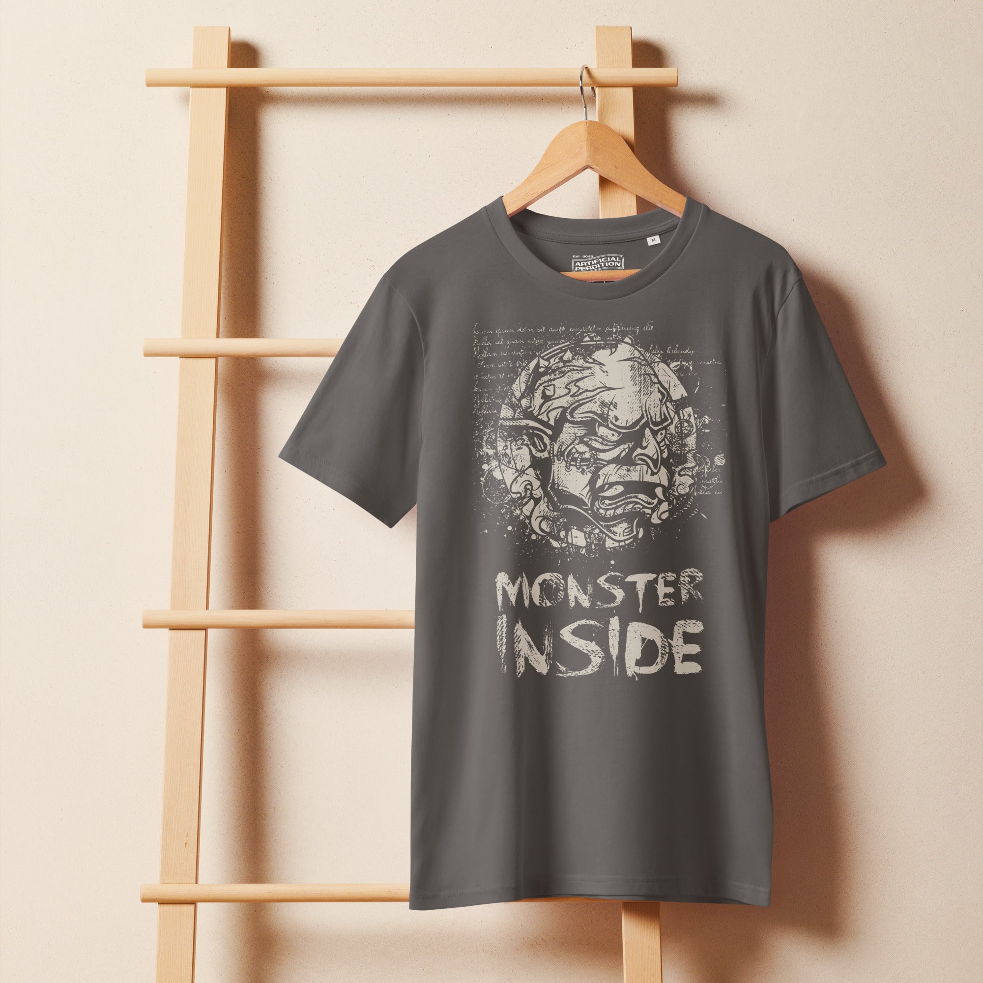 Black organic cotton t-shirt featuring a horned monster breaking from a ritual circle with mystical script and “Monster Inside” text.