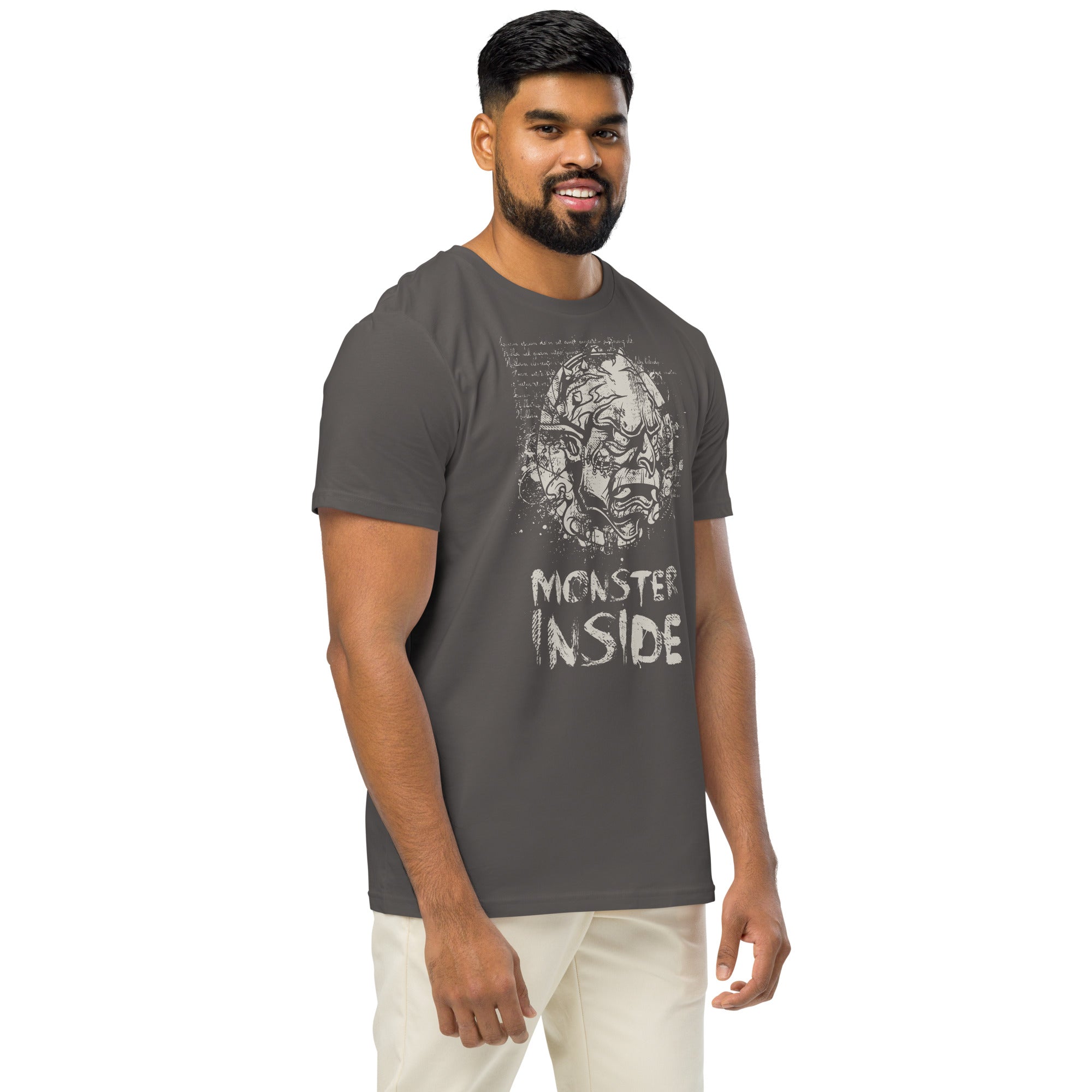 Black organic cotton t-shirt featuring a horned monster breaking from a ritual circle with mystical script and “Monster Inside” text.