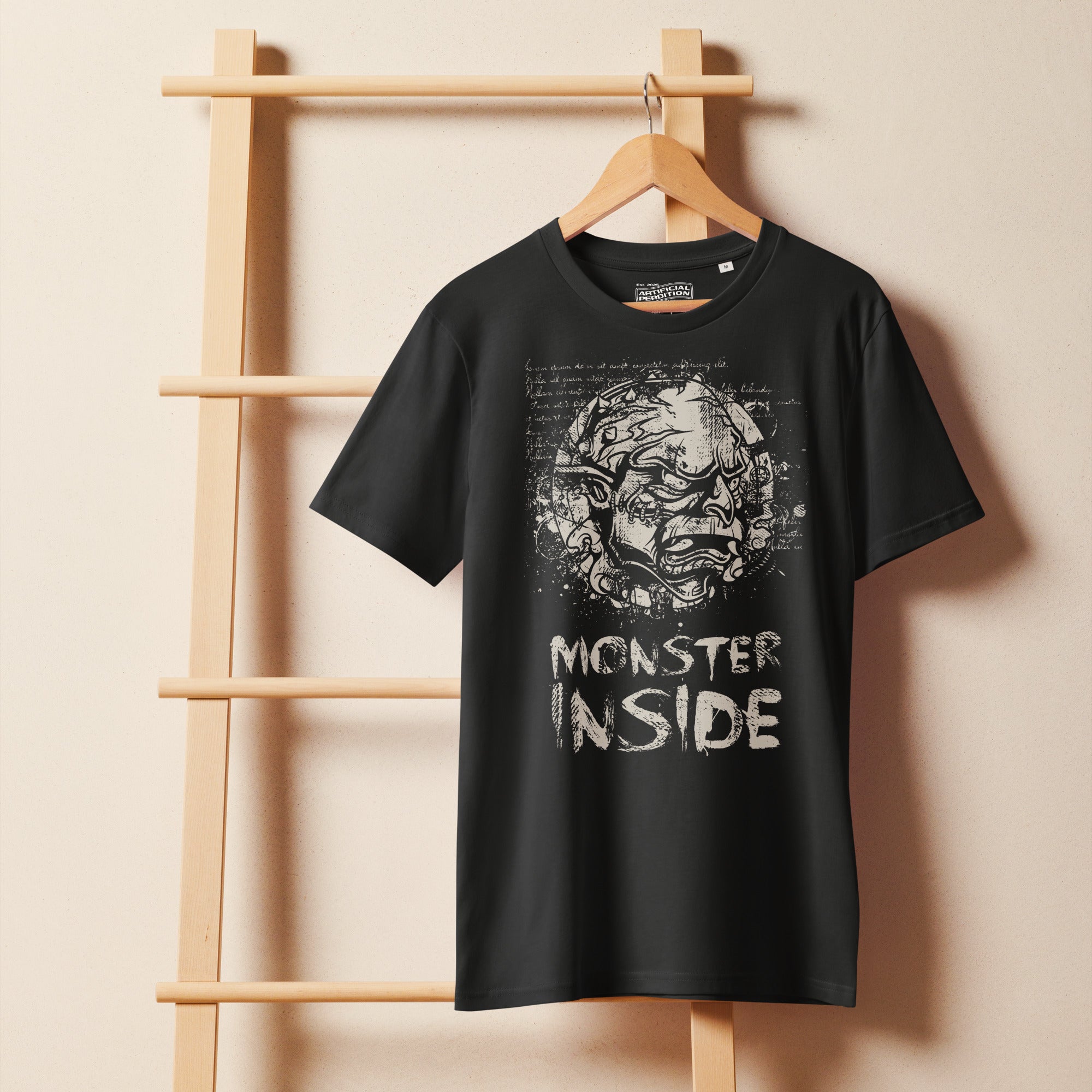 Black organic cotton t-shirt featuring a horned monster breaking from a ritual circle with mystical script and “Monster Inside” text.