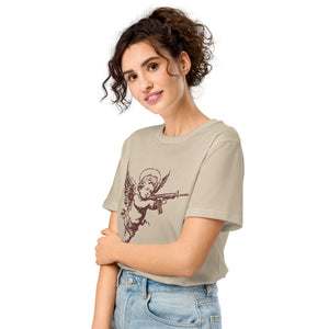 A woman wearing an angelic cherub with a rifle on a distressed premium organic eco mid-light desert dust t-shirt.
