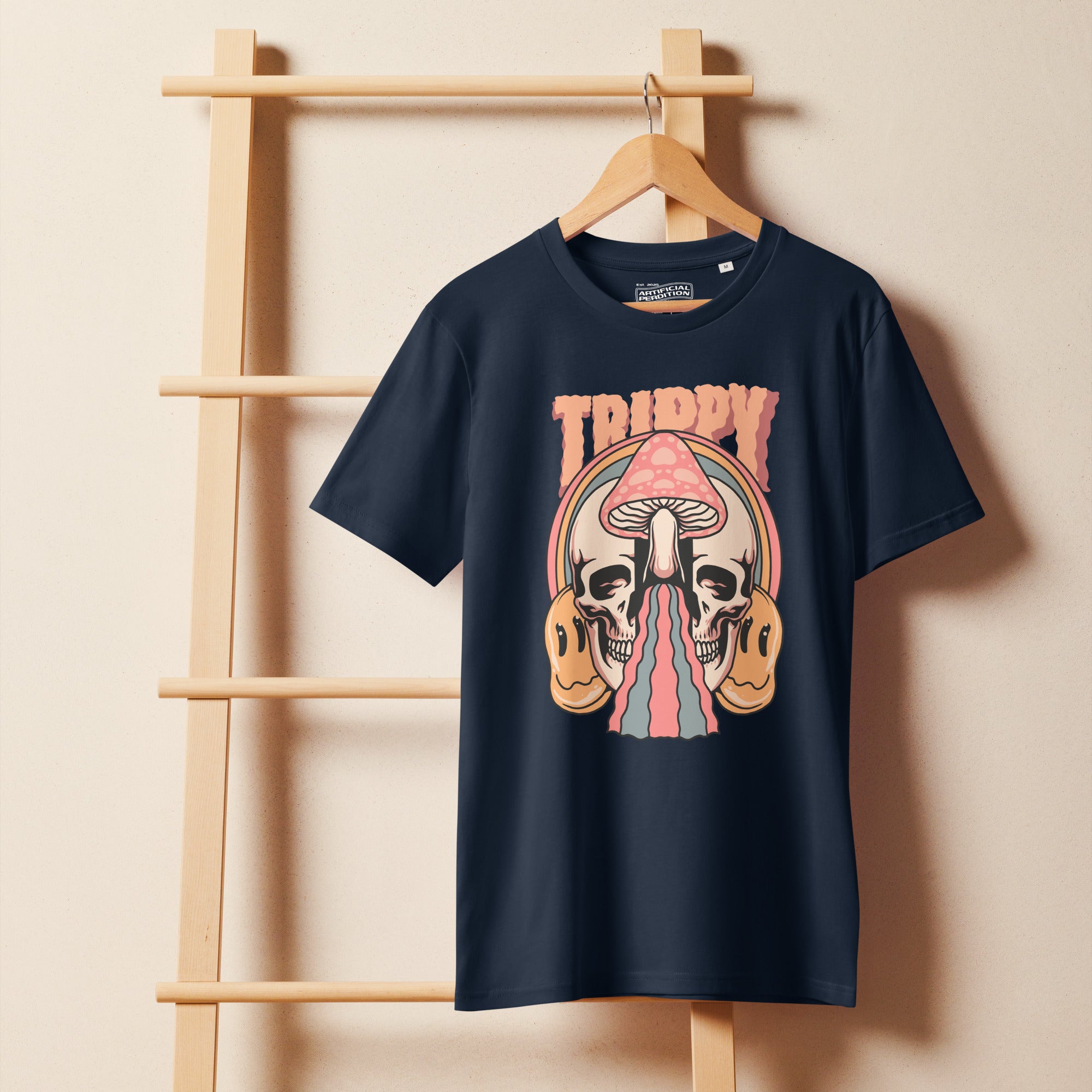 Mid-light organic cotton t-shirt showing a split skull divided by a pink mushroom, with flowing psychedelic shapes and small smiley faces.