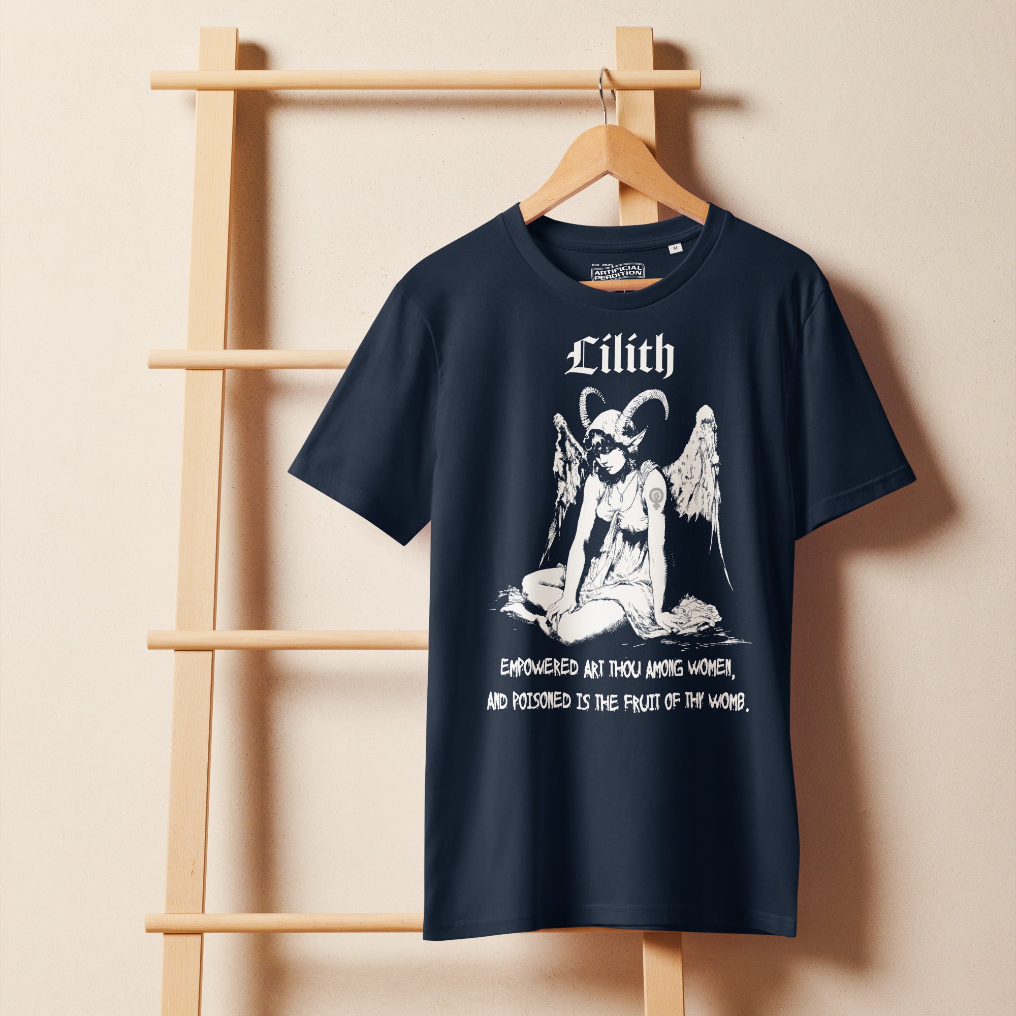 Organic mid-light cotton t-shirt featuring a black-and-white Lilith illustration with horns and wings and gothic lettering.