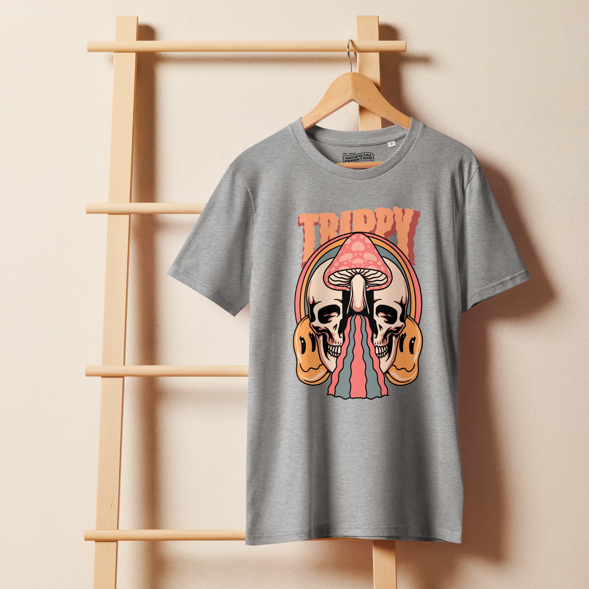 Mid-light organic cotton t-shirt showing a split skull divided by a pink mushroom, with flowing psychedelic shapes and small smiley faces.