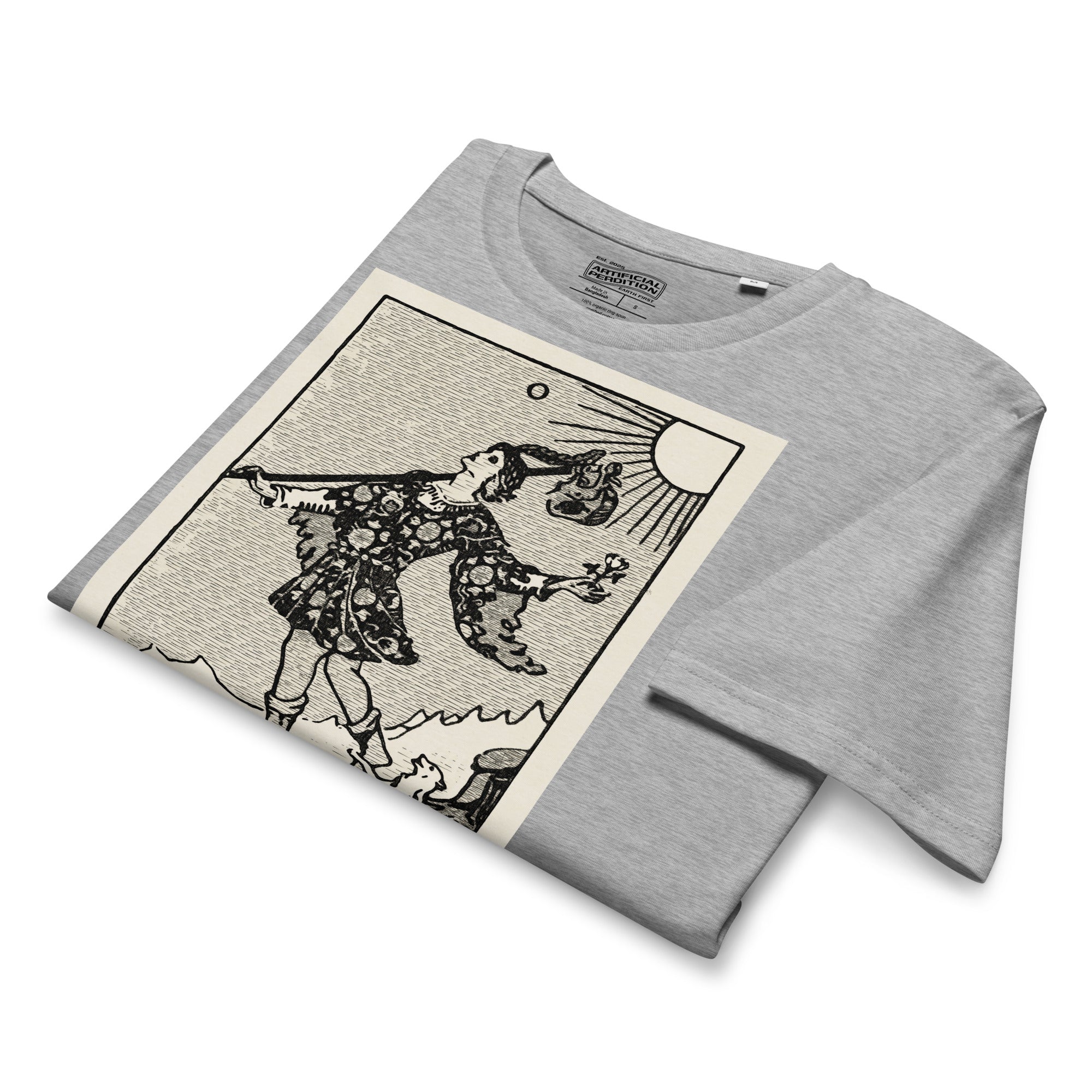Mid-light organic cotton t-shirt featuring The Fool tarot card with cliff, dog, and sun in high-contrast woodcut rendering.