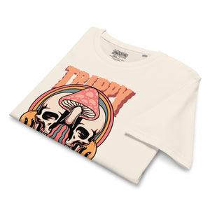 Mid-light organic cotton t-shirt showing a split skull divided by a pink mushroom, with flowing psychedelic shapes and small smiley faces.