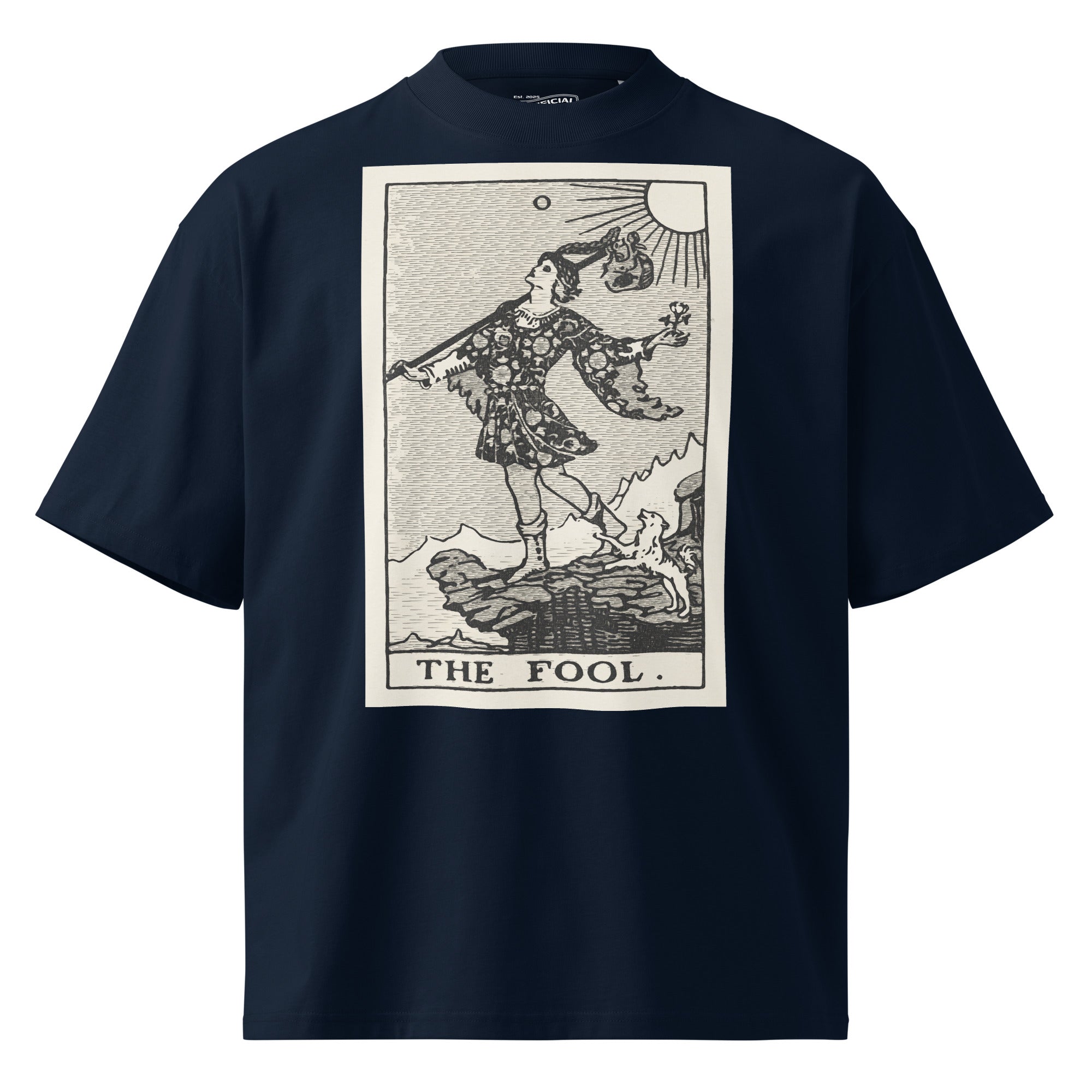 Oversized organic cotton t-shirt displaying The Fool tarot card with cliff, dog, and rising sun in modern woodcut style.