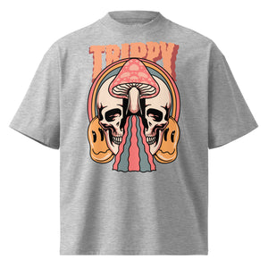 Oversized organic cotton t-shirt showing a split skull pierced by a pink mushroom, with melting psychedelic shapes and small smiley faces.