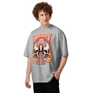 Oversized organic cotton t-shirt showing a split skull pierced by a pink mushroom, with melting psychedelic shapes and small smiley faces.