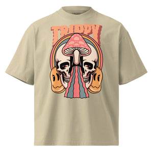 Oversized organic cotton t-shirt showing a split skull pierced by a pink mushroom, with melting psychedelic shapes and small smiley faces.