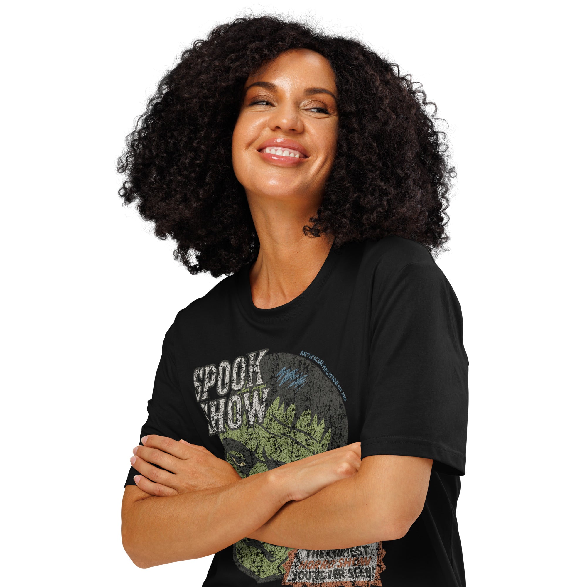 A woman standing with arms crossed wearing a distressed Frankenstein head with “Spook Show” on a premium organic  heavyweight black t-shirt.