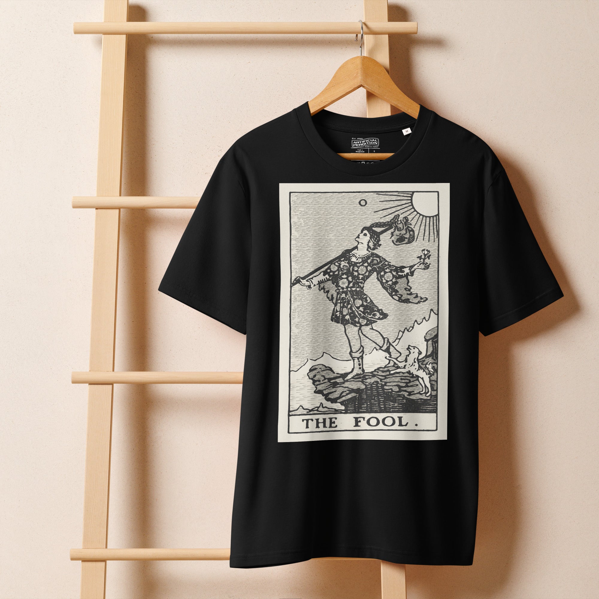 Heavyweight organic cotton t-shirt with The Fool tarot illustration rendered in modern woodcut style.