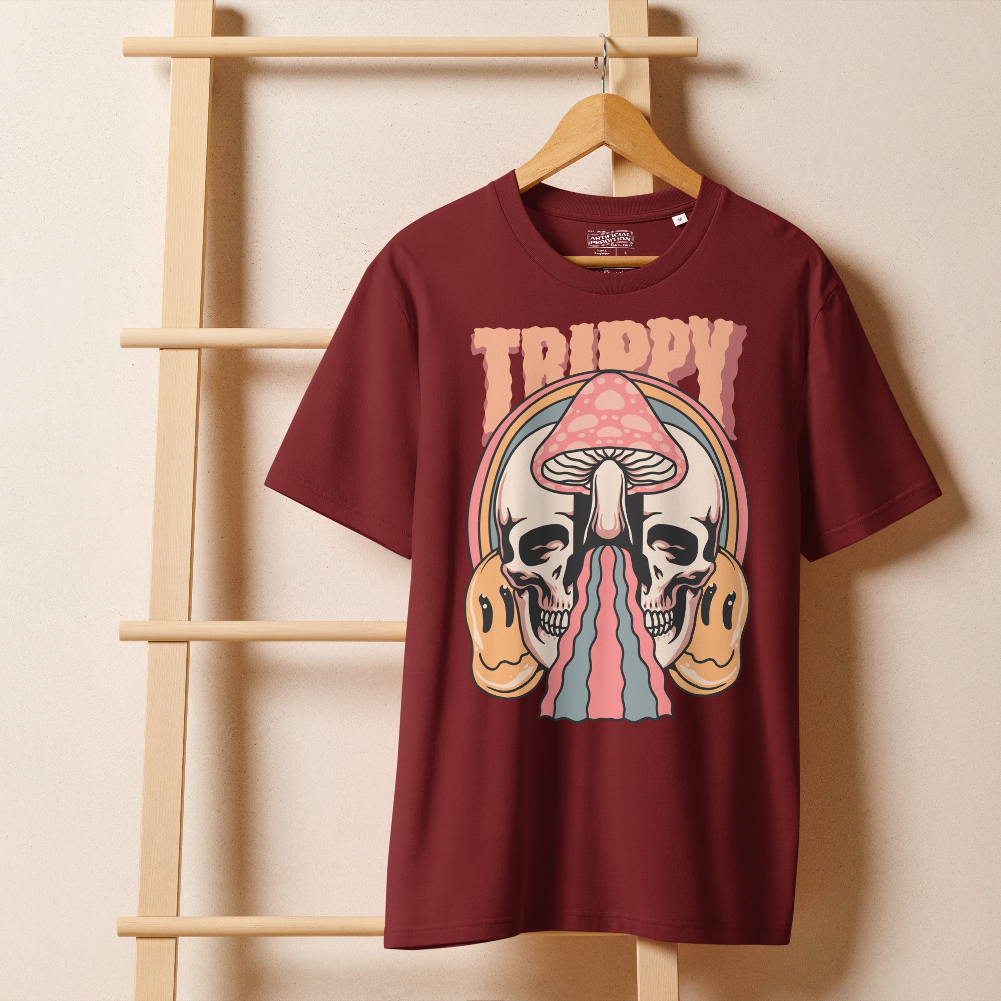 Heavyweight organic cotton t-shirt featuring a split skull pierced by a pink mushroom, with melting psychedelic shapes and small smiley faces.