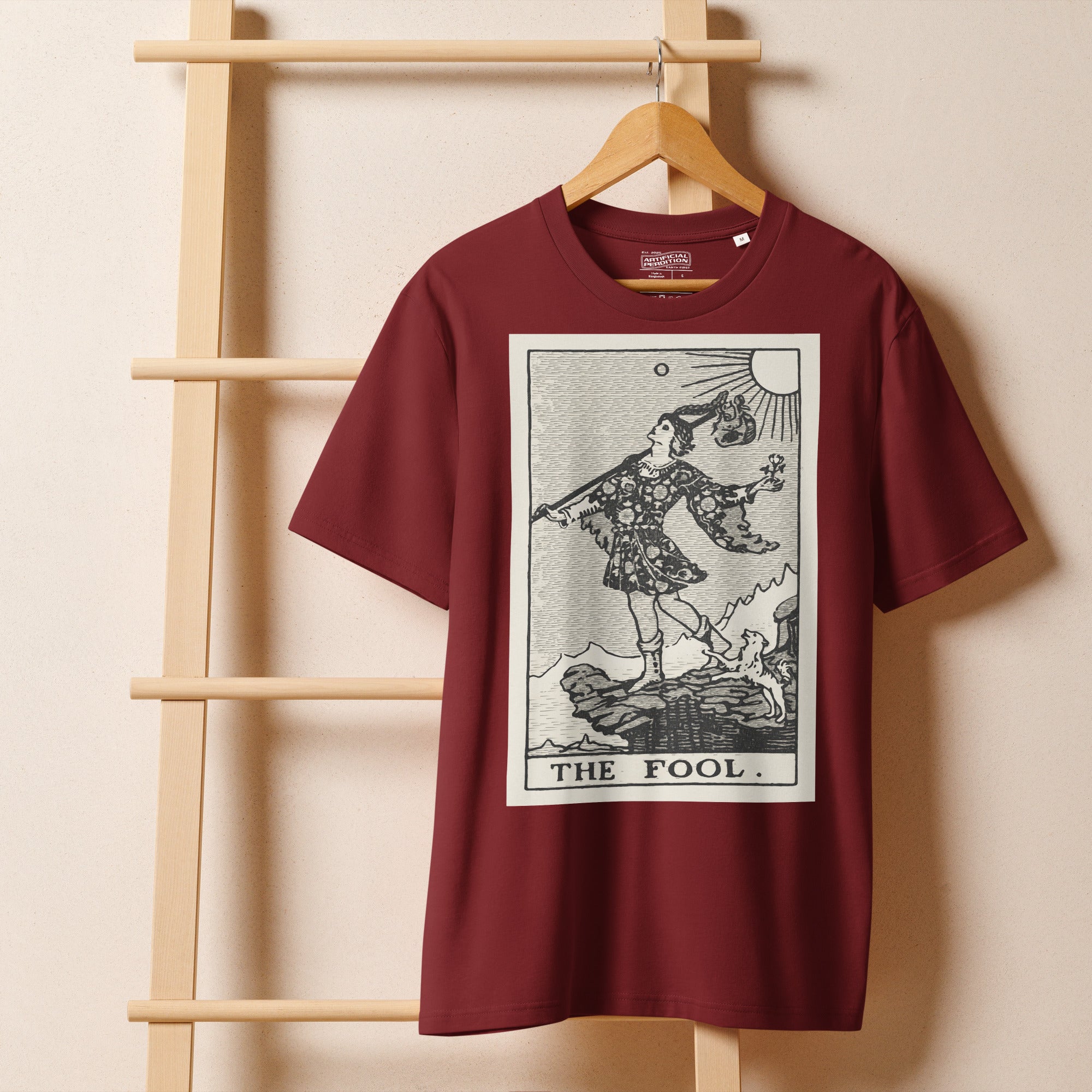 Heavyweight organic cotton t-shirt with The Fool tarot illustration rendered in modern woodcut style.