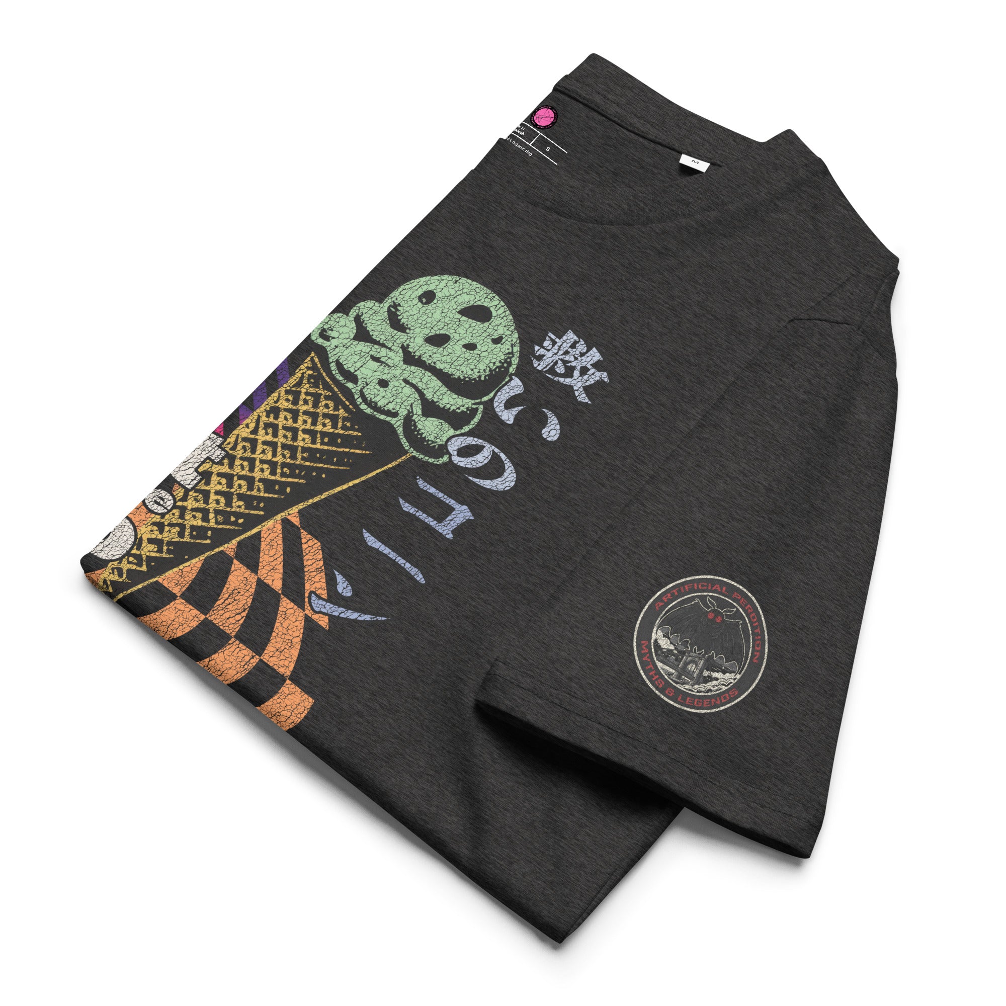The lfolded view of a dark heather grey heavyweight tee featuring half of an ice cream cone and the Japanese kanji 救いのコーン (Sukui no kōn) — “Cone of Salvation." There is a circular badge of mothman over a bridge with the words "artificial perdition | myths & legends."