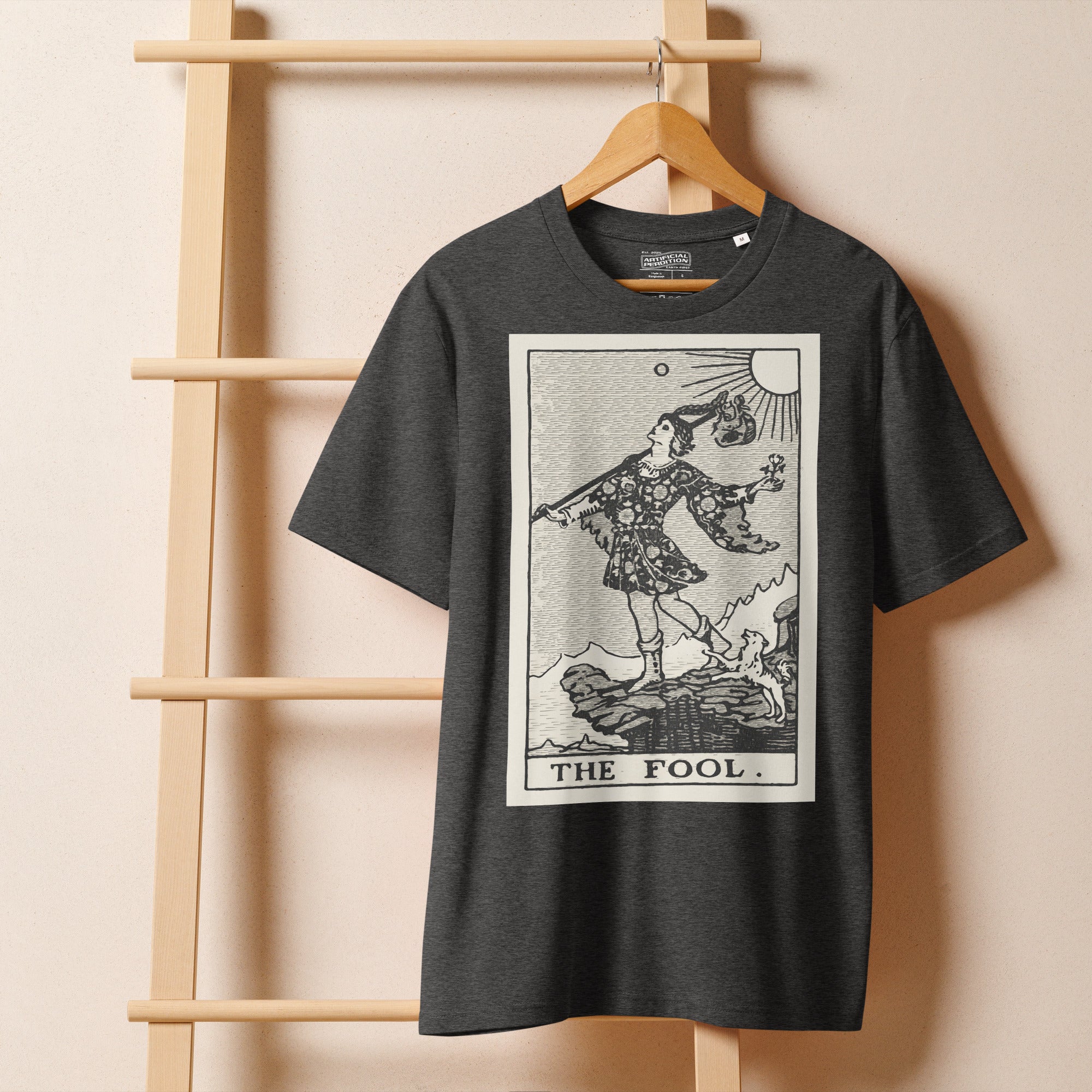 Heavyweight organic cotton t-shirt with The Fool tarot illustration rendered in modern woodcut style.