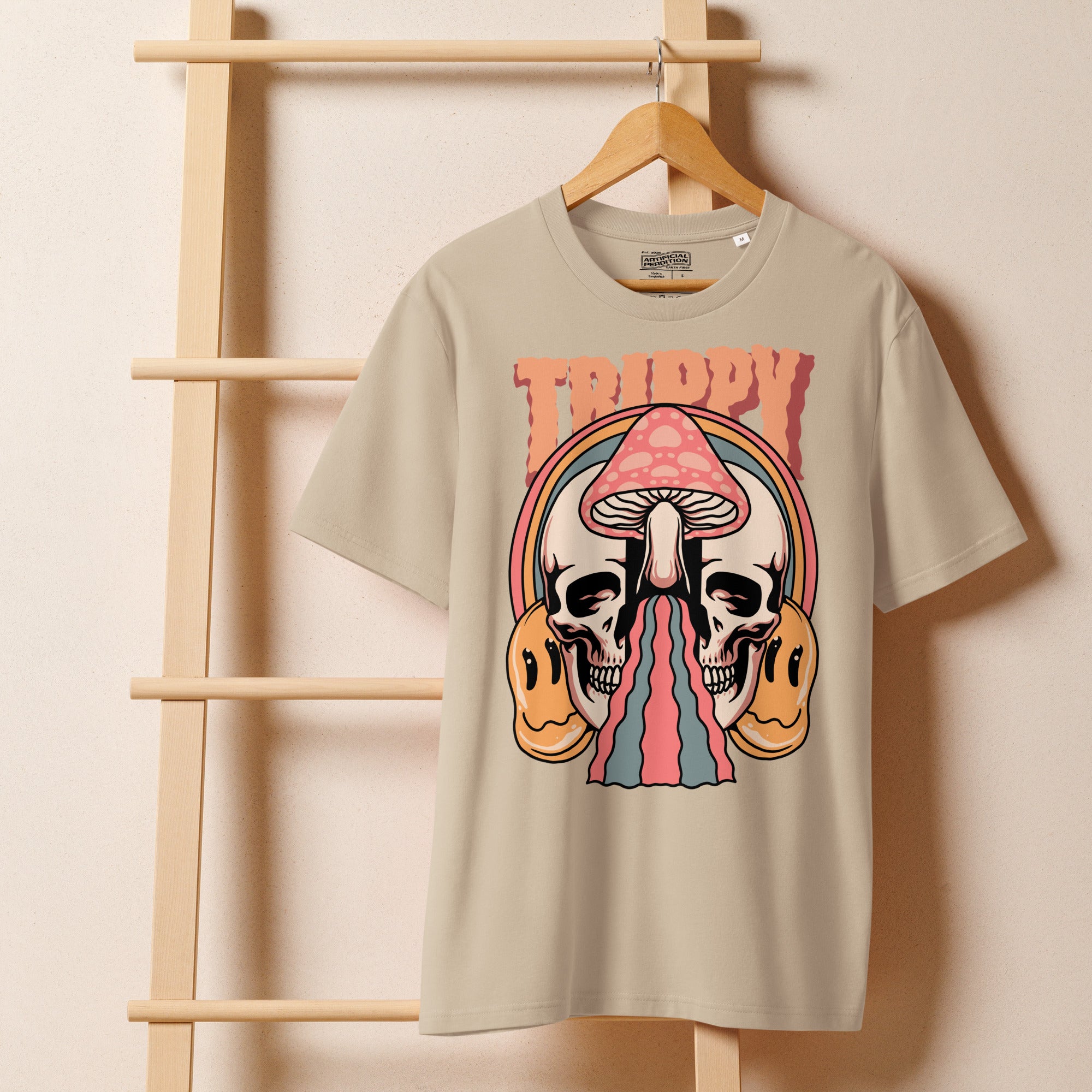 Heavyweight organic cotton t-shirt featuring a split skull pierced by a pink mushroom, with melting psychedelic shapes and small smiley faces.