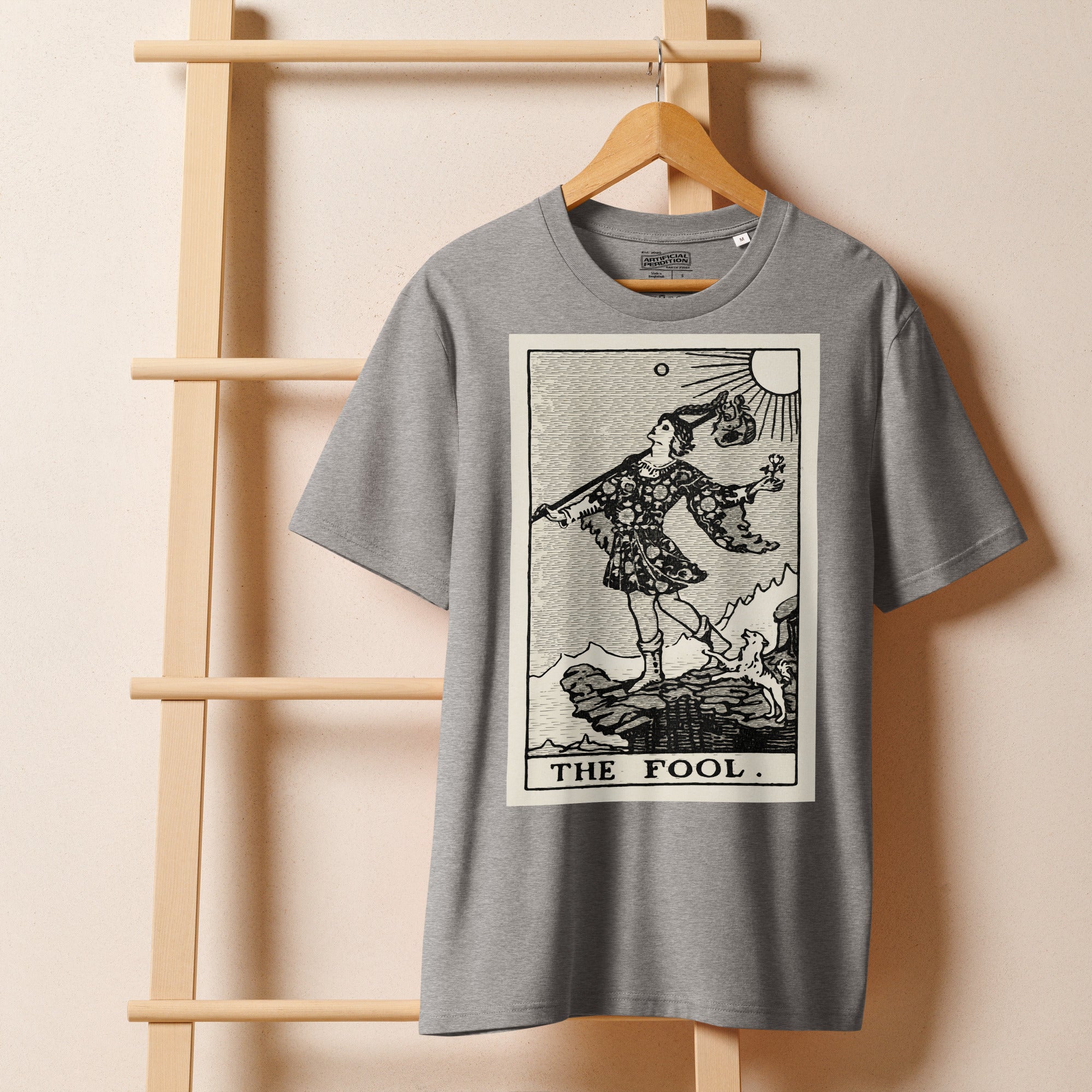 Heavyweight organic cotton t-shirt with The Fool tarot illustration rendered in modern woodcut style.