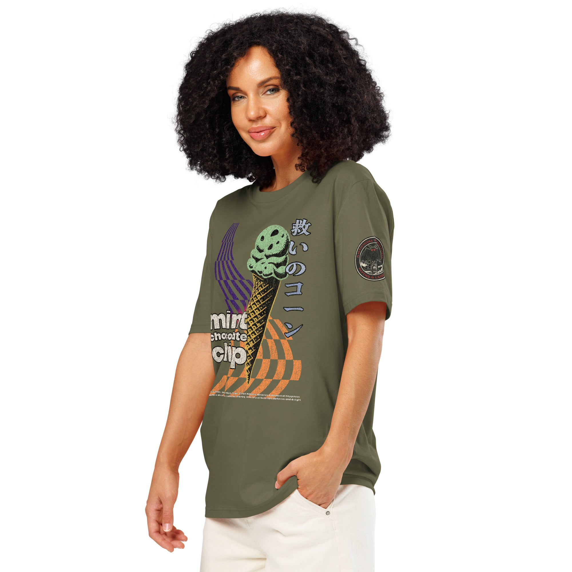 The side view of a khaki heavyweight tee featuring  the circular badge of mothman over a bridge with the words "artificial perdition | myths & legends."