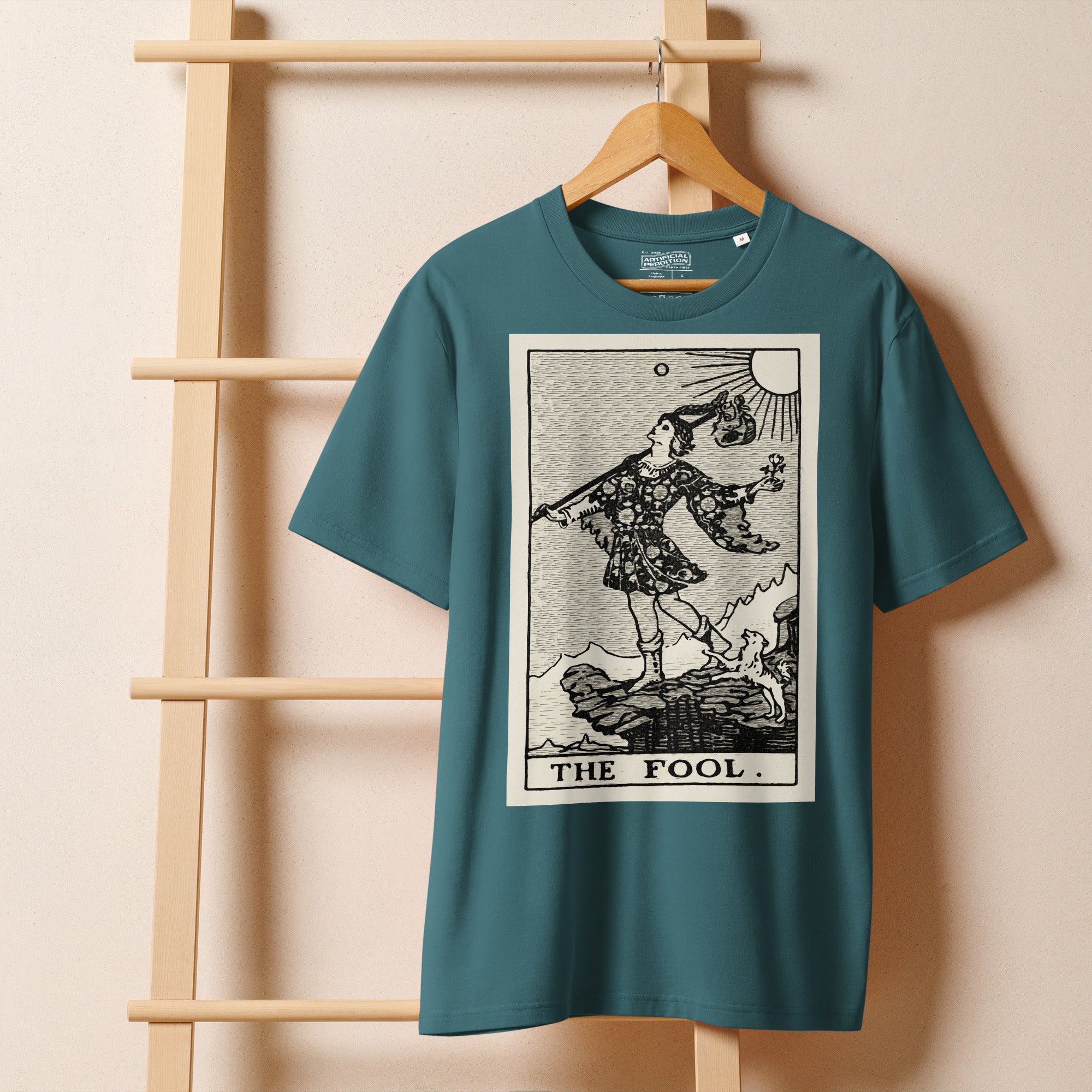 Heavyweight organic cotton t-shirt with The Fool tarot illustration rendered in modern woodcut style.