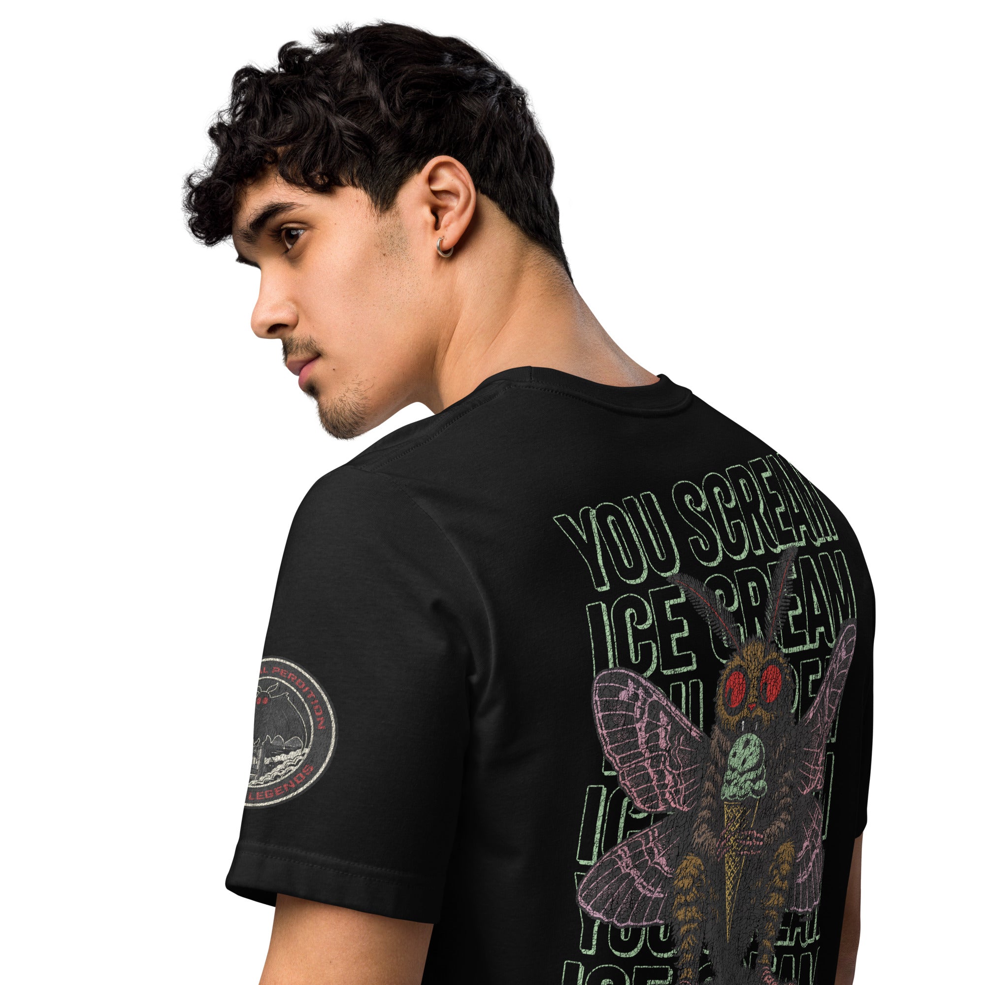 The back of a core tee shirt features a man wearing a black core tee shirt. The image is of Mothman eating an ice cream cone with the repeating words "you scream | ice cream."