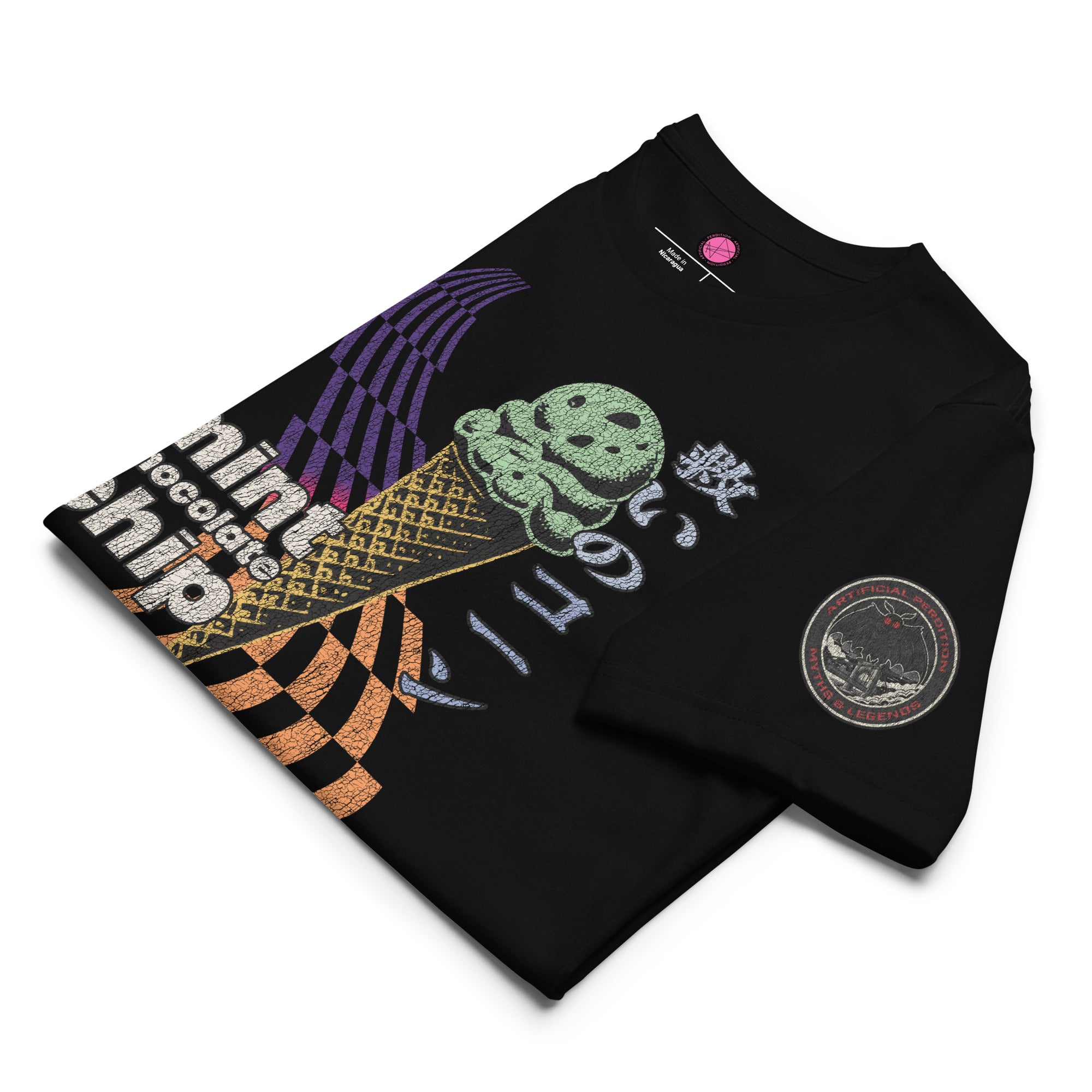 The front of a black core tee featuring the word "mint chocolate chip," an ice cream cone, and the Japanese kanji “救いのコーン," which translates to "Cone of Salvation." There is a circular badge of Mothman over a bridge with the words "artificial perdition | myths and legends," on the left sleeve.