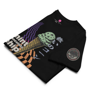 The front of a black core tee featuring the word "mint chocolate chip," an ice cream cone, and the Japanese kanji “救いのコーン," which translates to "Cone of Salvation." There is a circular badge of Mothman over a bridge with the words "artificial perdition | myths and legends," on the left sleeve.