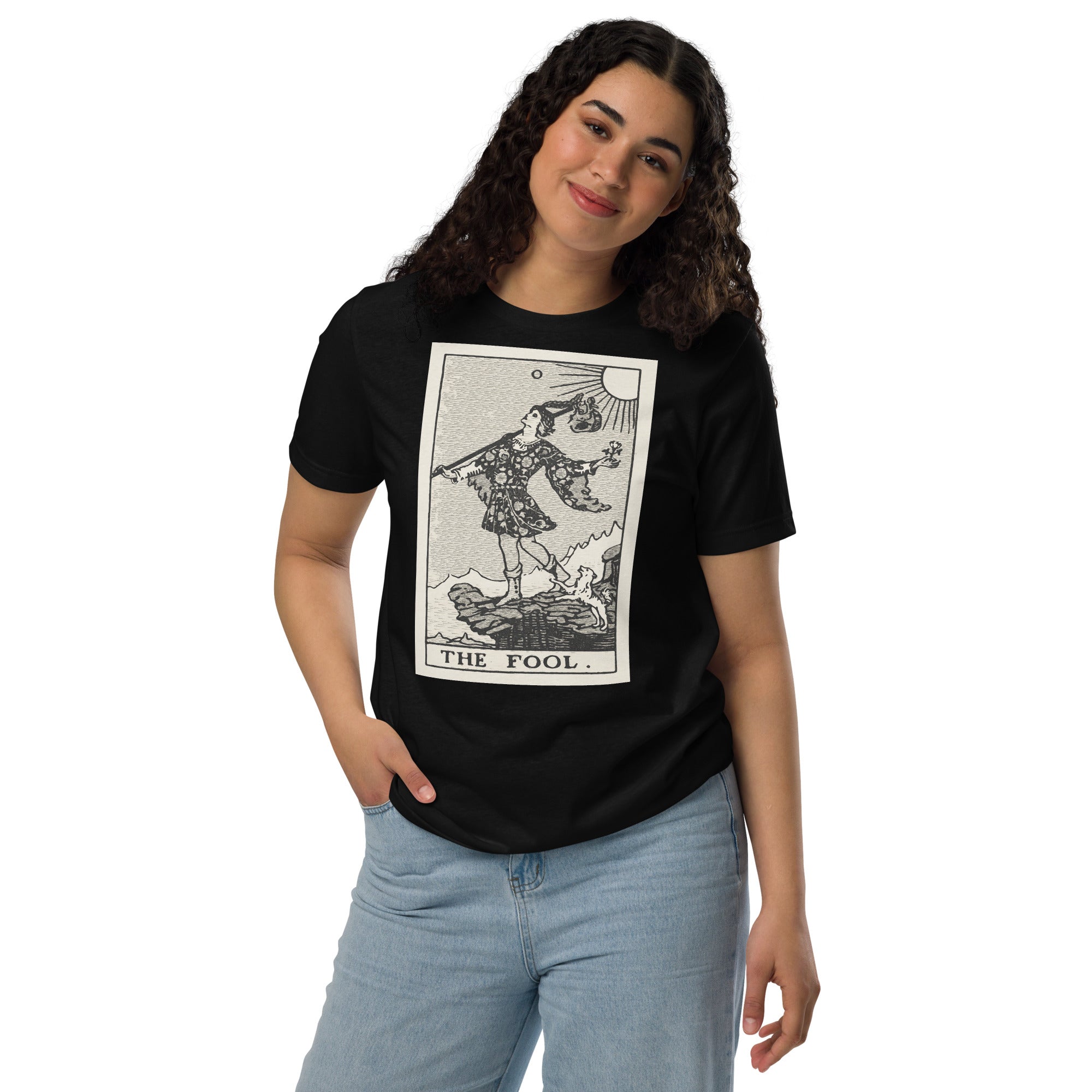 Recycled blend t-shirt featuring The Fool tarot card, showing a traveler at a cliff edge with a dog and rising sun in a modern woodcut style.