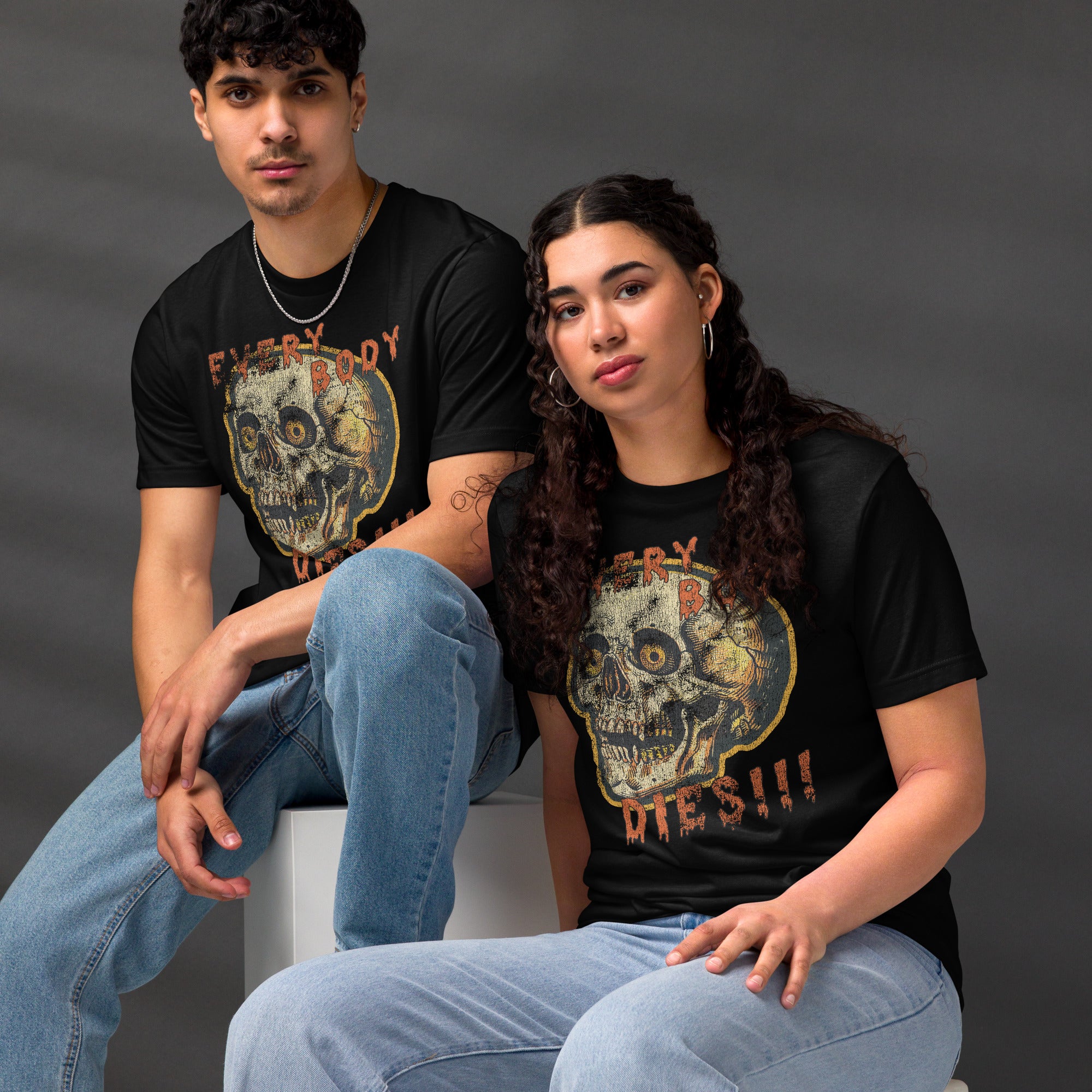 Die-cut skull with amber eyes and dripping orange horror font reading EVERY BODY DIES, vintage pulp style, Artificial Perdition apparel