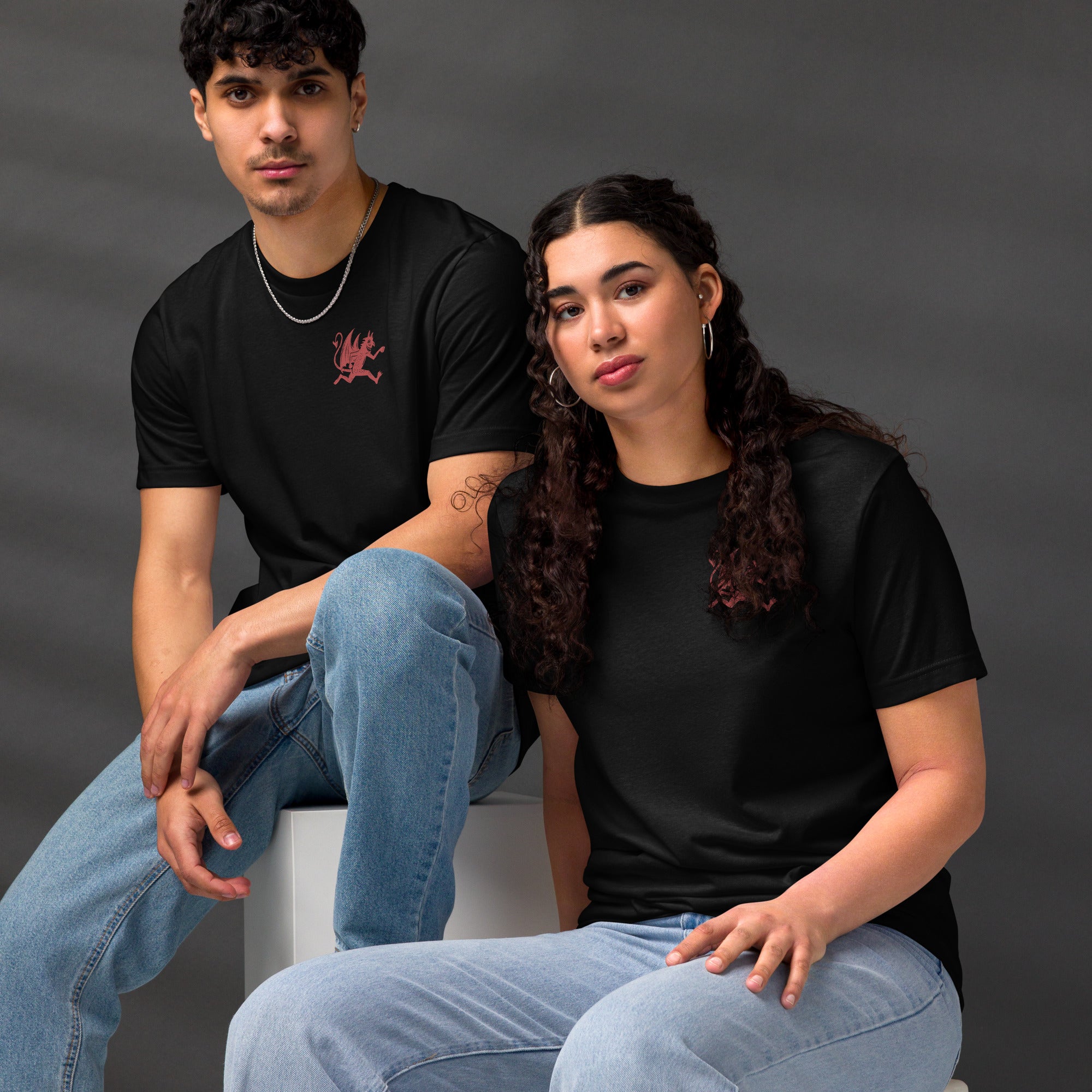 Artificial Perdition devil mascot, red illustrated devil mid-stride with trident and brand name, hand-drawn style on black, official logo tee
