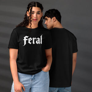 Feral in white blackletter font on dark heather grey t-shirt, bold single word graphic design, Artificial Perdition apparel
