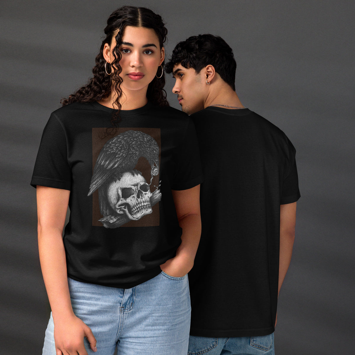Graphite illustration of a black corvid perched on a human skull removing the eye, sprouting branch beside it, Last Look, Artificial Perdition apparel