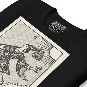 Recycled blend t-shirt featuring The Fool tarot card, showing a traveler at a cliff edge with a dog and rising sun in a modern woodcut style.
