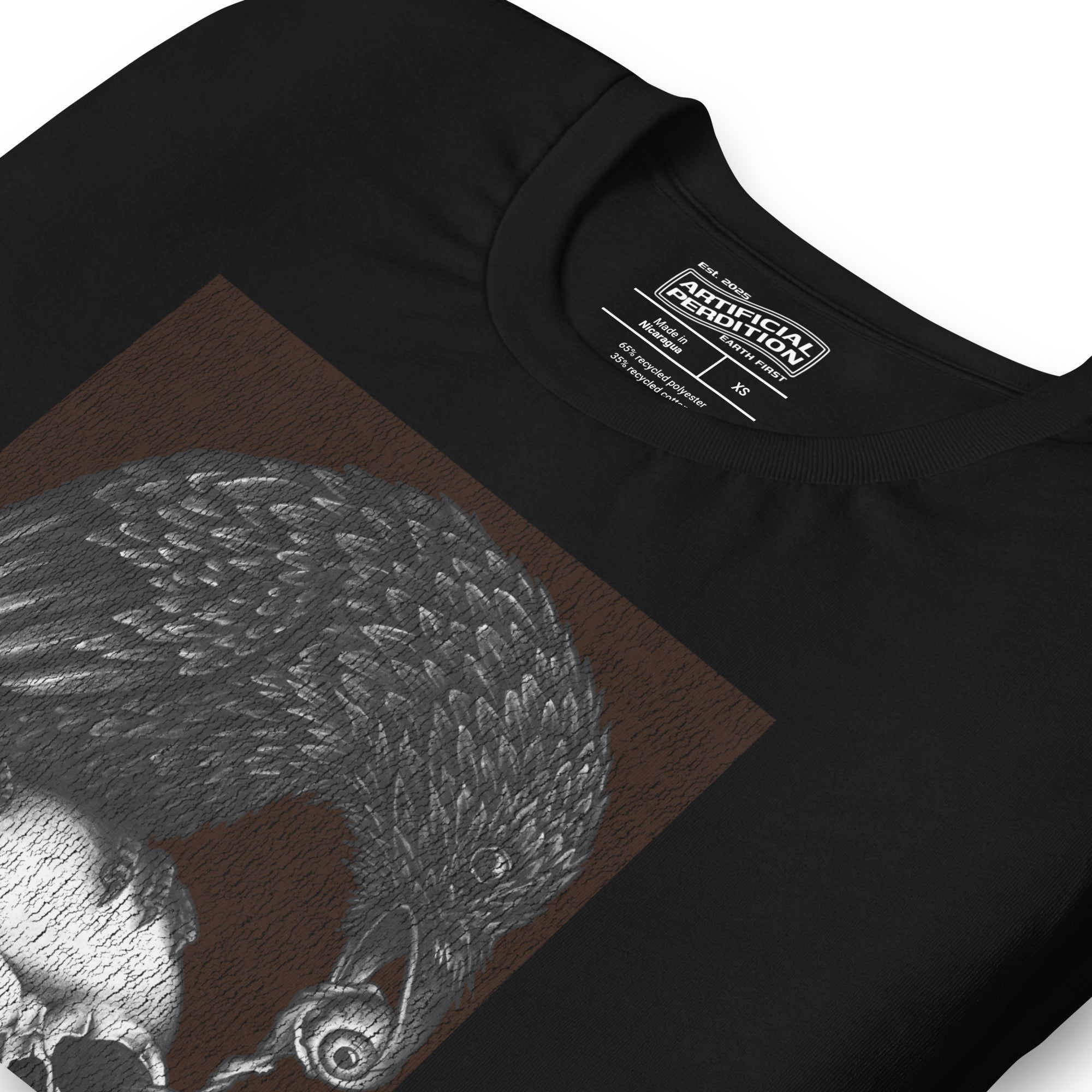 Graphite illustration of a black corvid perched on a human skull removing the eye, sprouting branch beside it, Last Look, Artificial Perdition apparel