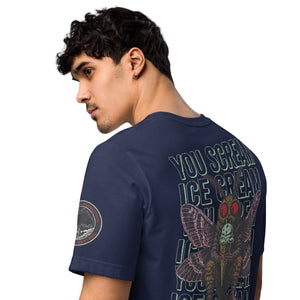 The navy of a core tee shirt features a man wearing a black core tee shirt. The image is of Mothman eating an ice cream cone with the repeating words "you scream | ice cream."