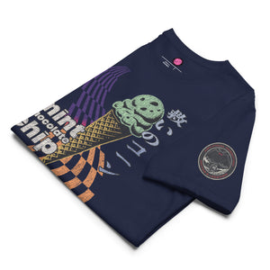 The front of a navy core tee featuring the word "mint chocolate chip," an ice cream cone, and the Japanese kanji “救いのコーン," which translates to "Cone of Salvation." There is a circular badge of Mothman over a bridge with the words "artificial perdition | myths and legends," on the left sleeve.