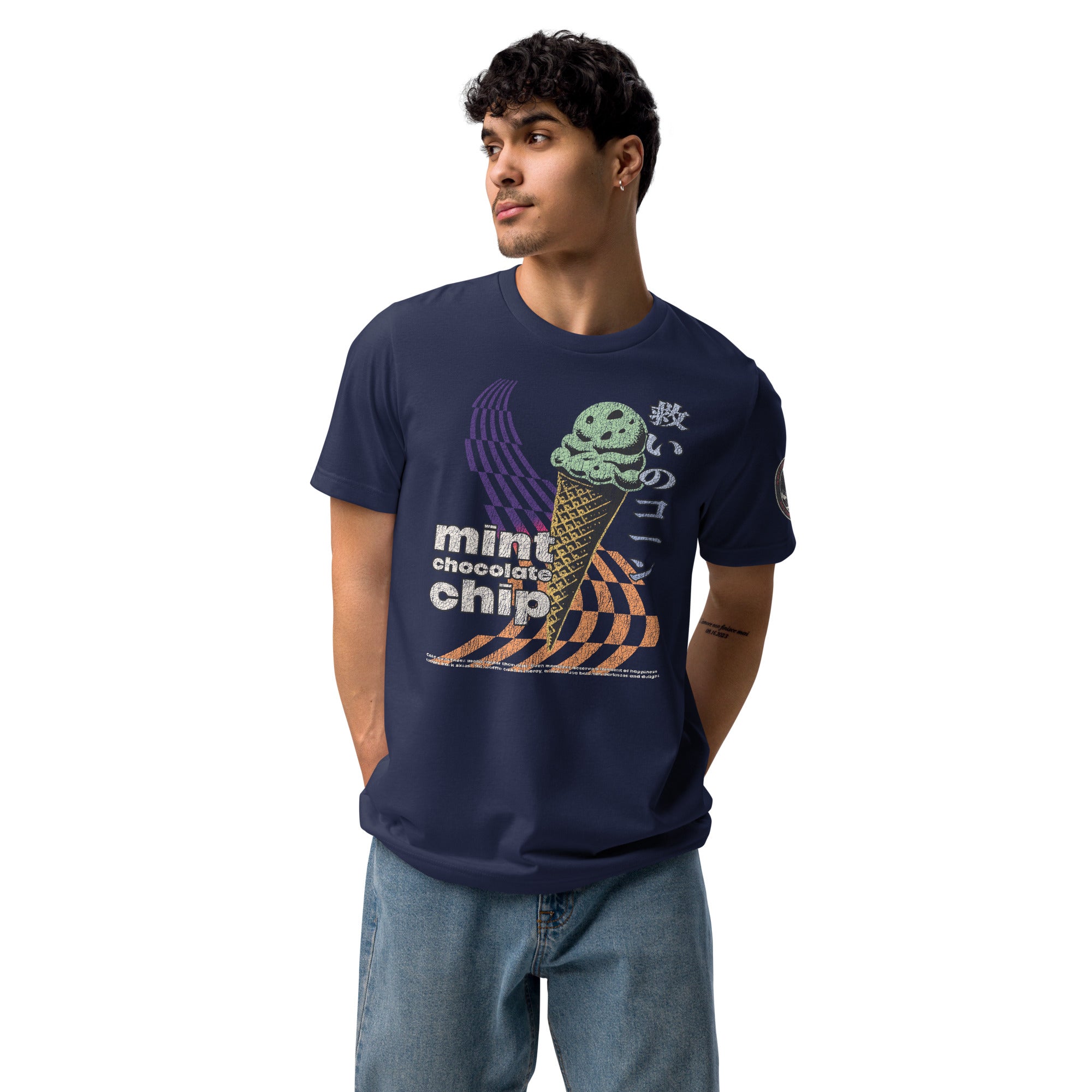 A man wearing a navy core tee featuring the word "mint chocolate chip," an ice cream cone, and the Japanese kanji “救いのコーン," which translates to "Cone of Salvation."