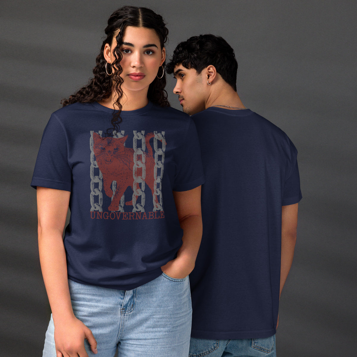 Product mockupSnarling cat breaking through chains with UNGOVERNABLE text, dithered halftone red on cream, Artificial Perdition apparel