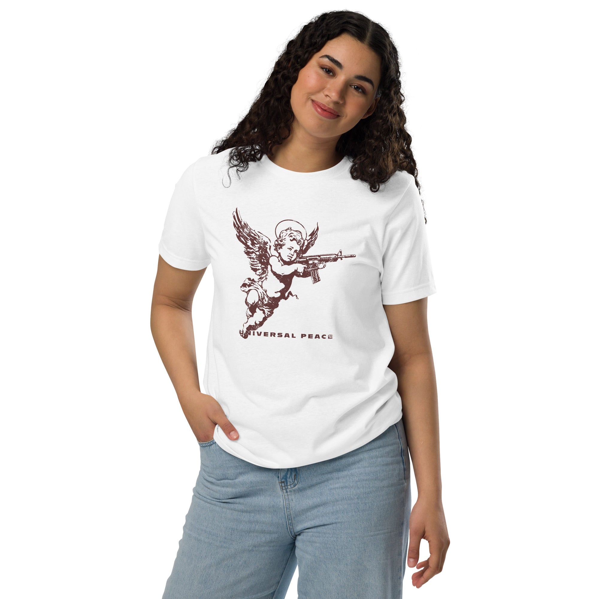 A woman standing wearing a shirt with a cherub holding rifle under “Universal Peace" on a premium eco recycled fabrics white t-shirt.