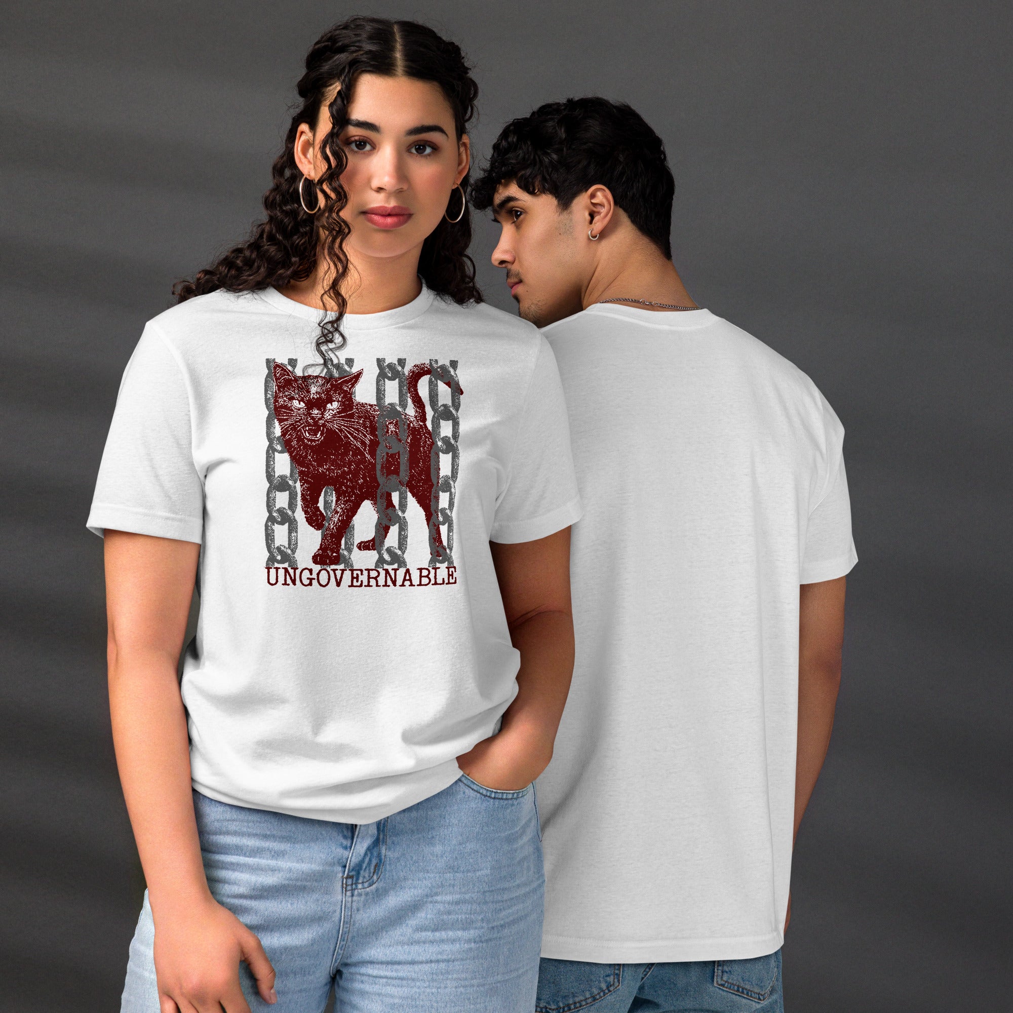 Snarling cat breaking through chains with UNGOVERNABLE text, dithered halftone red on cream, Artificial Perdition apparel