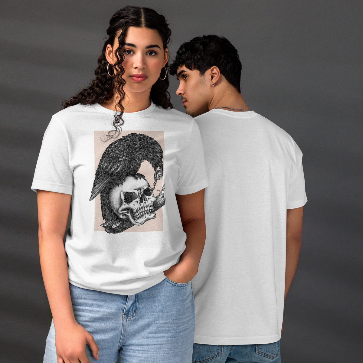 Graphite illustration of a black corvid perched on a human skull removing the eye, sprouting branch beside it, Last Look, Artificial Perdition apparel