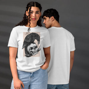 Graphite illustration of a black corvid perched on a human skull removing the eye, sprouting branch beside it, Last Look, Artificial Perdition apparel