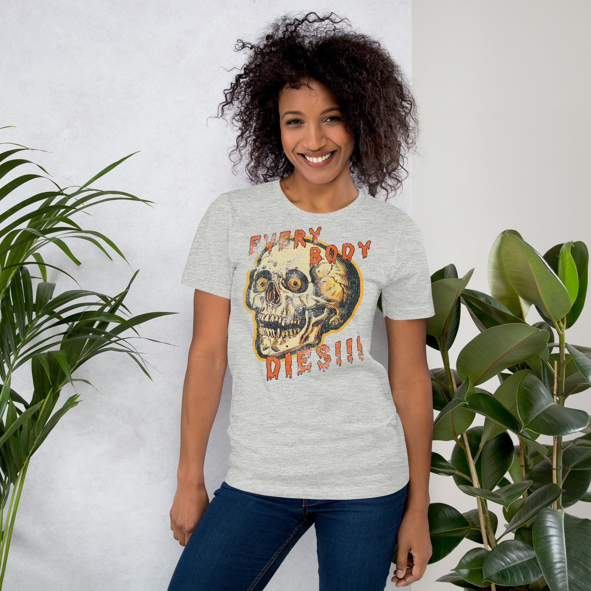 Die-cut skull with amber eyes and dripping orange horror font reading EVERY BODY DIES, vintage pulp style, Artificial Perdition apparel