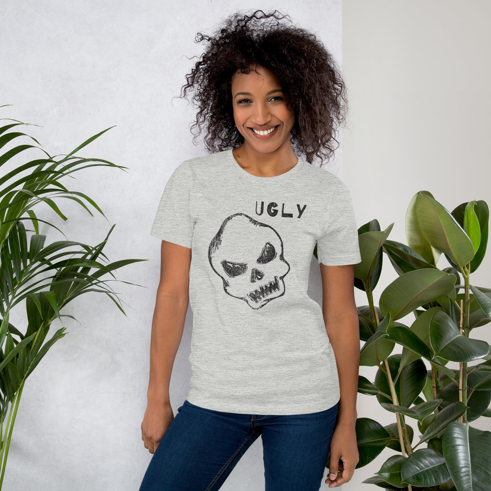 Crude hand-drawn skull with mismatched eye sockets and UGLY text in the upper corner, anti-polish graphic design, Artificial Perdition apparel