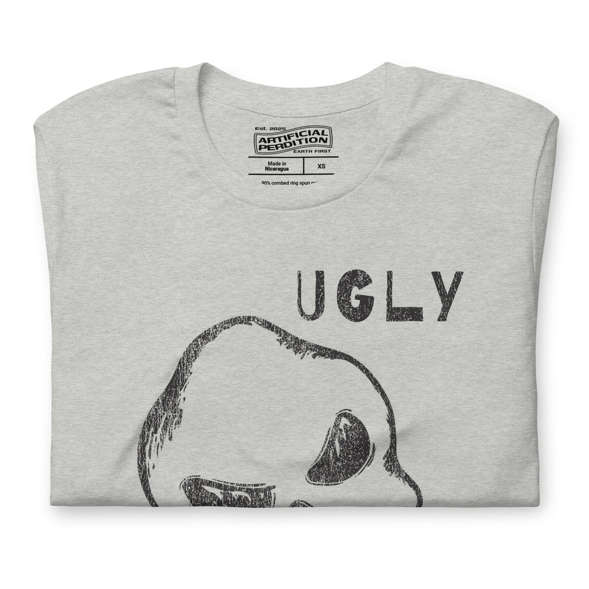 Crude hand-drawn skull with mismatched eye sockets and UGLY text in the upper corner, anti-polish graphic design, Artificial Perdition apparel