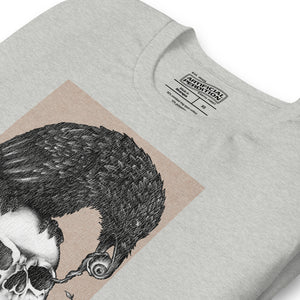 Graphite illustration of a black corvid perched on a human skull removing the eye, sprouting branch beside it, Last Look, Artificial Perdition apparel