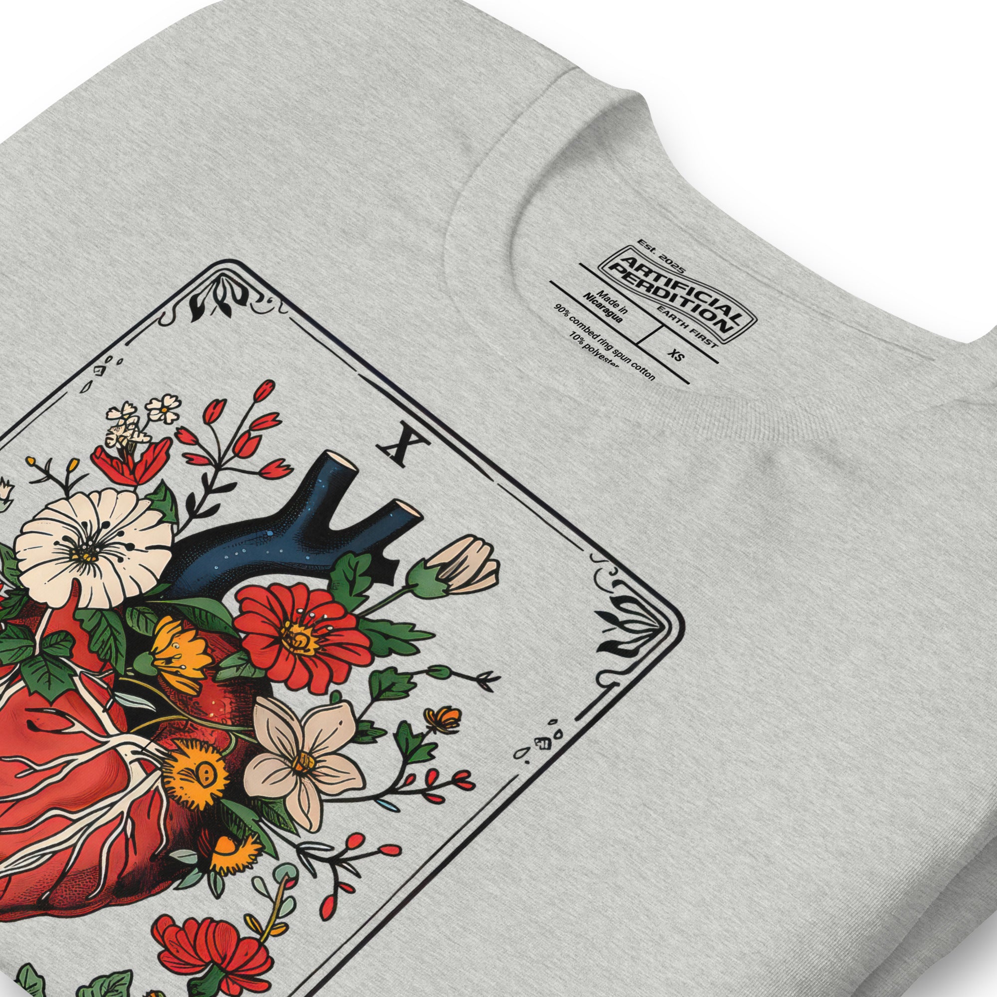Tarot card illustration numbered X with an anatomical heart in bloom surrounded by wildflowers and vines, Amor Fati, Artificial Perdition apparel