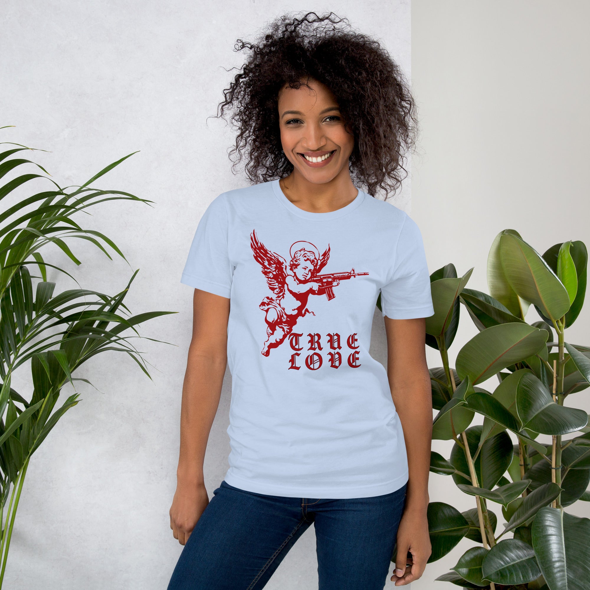 Red cherub angel with halo aiming rifle above blackletter True Love text, dark ironic tattoo flash style, Artificial Perdition apparel