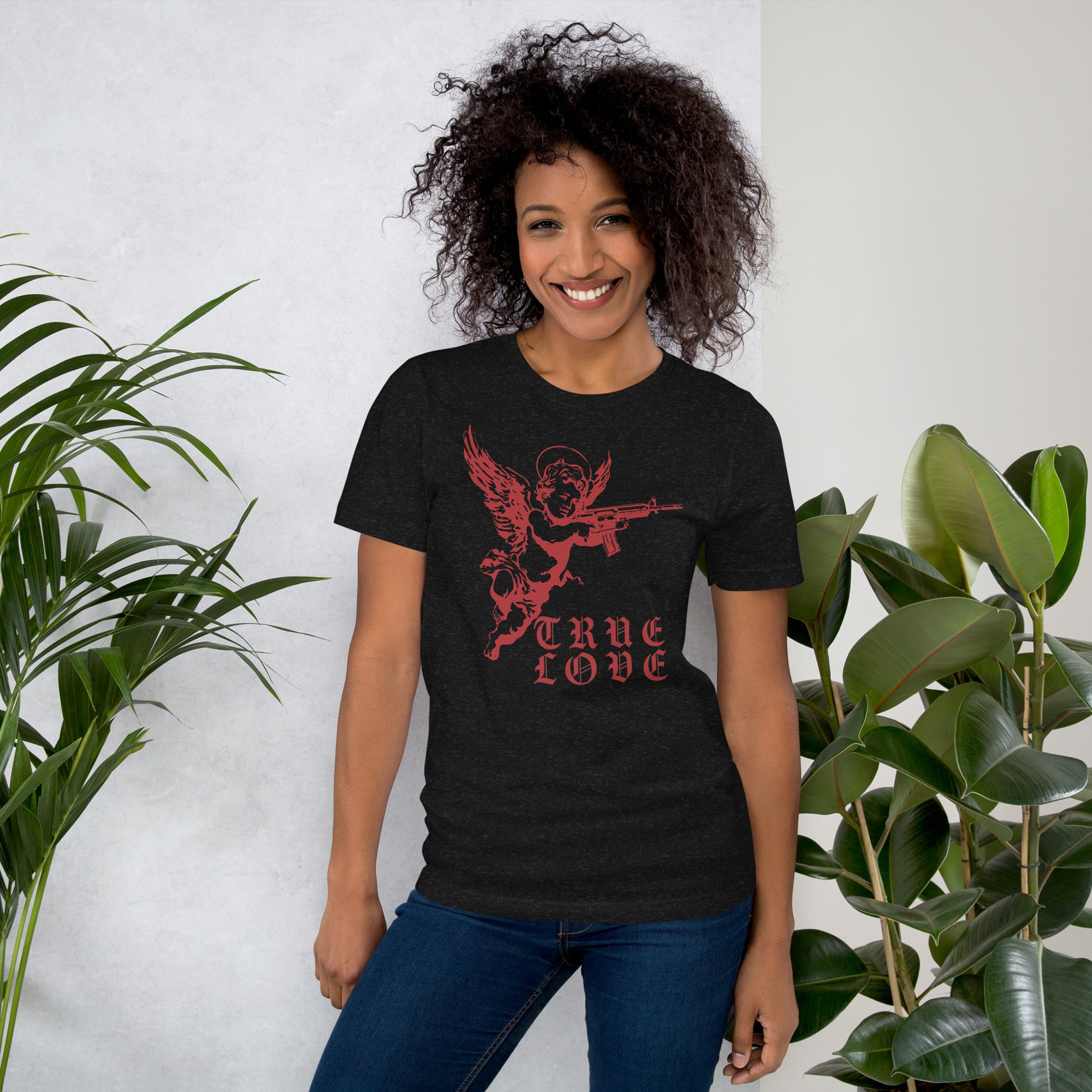 Red cherub angel with halo aiming rifle above blackletter True Love text, dark ironic tattoo flash style, Artificial Perdition apparel