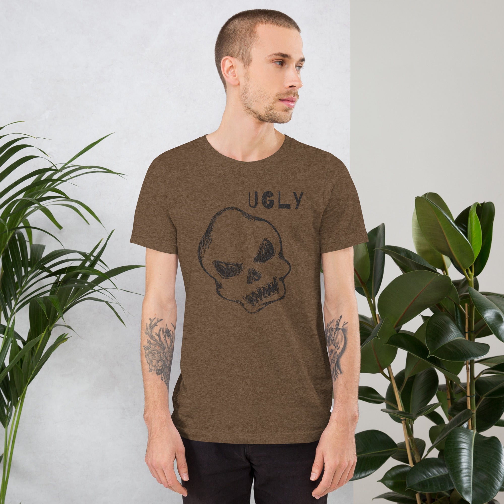 Crude hand-drawn skull with mismatched eye sockets and UGLY text in the upper corner, anti-polish graphic design, Artificial Perdition apparel