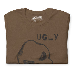 Crude hand-drawn skull with mismatched eye sockets and UGLY text in the upper corner, anti-polish graphic design, Artificial Perdition apparel